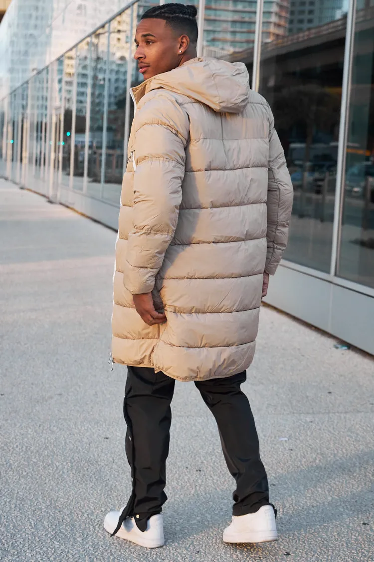 Doudoune matelassée longue beige à capuche